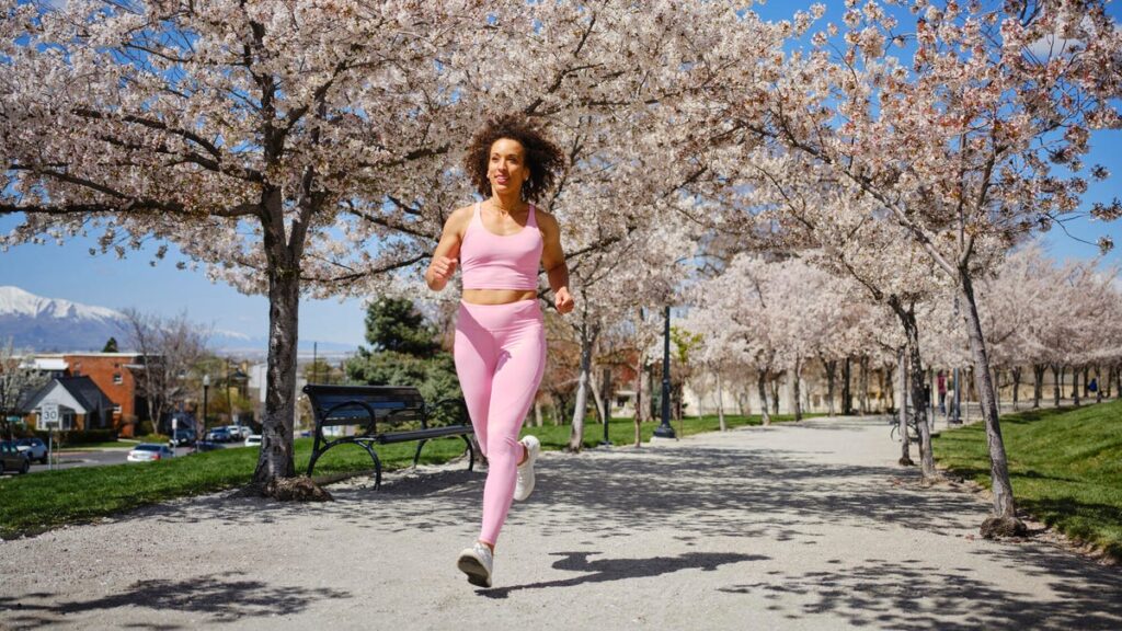 1744537035 person running under cherry blossoms.jpg