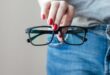 Person holding black glasses.jpg