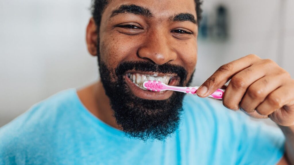 Person brushing teeth.jpg
