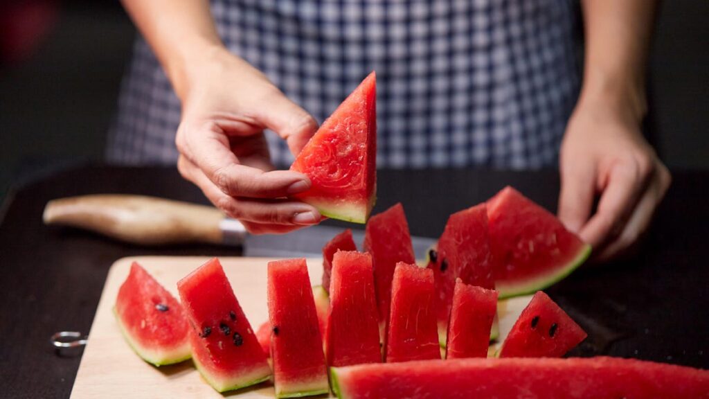 Person cutting watermelon.jpg