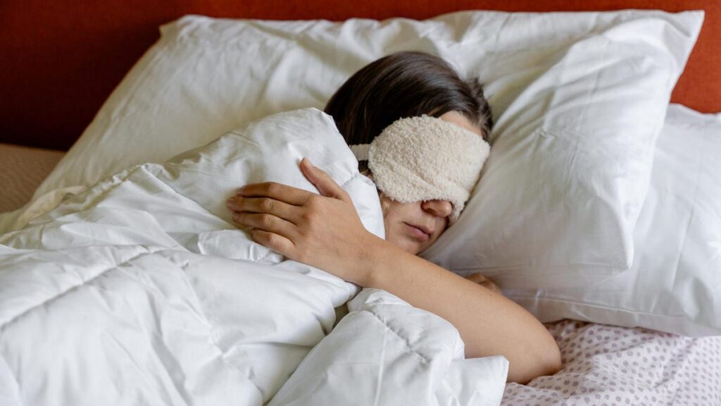 Person sleeping with eye mask.jpg